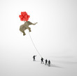 Elephant lifted by balloons