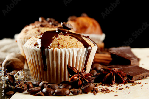 Photo: tasty muffin cakes with chocolate, spices and coffee seeds, tasty muffin cakes with chocolate, spices and coffee seeds,