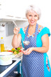 Foto: Mature woman on the kitchen Mature woman on the kitchen