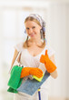 Happy housewife shows a thumb up