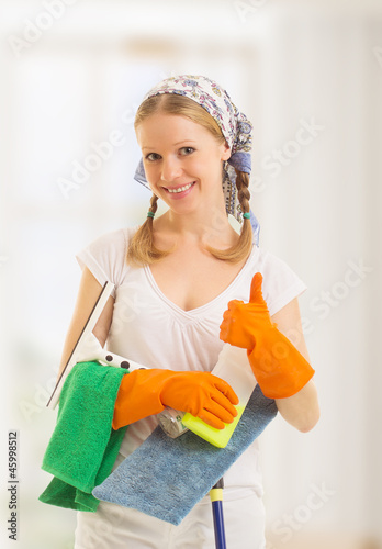 Photo: Happy housewife shows a thumb up Happy housewife shows a thumb up