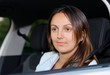Woman looking out of a car window