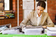 pretty female school teacher working in office