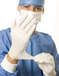 Photo: doctor putting gloves doctor putting gloves