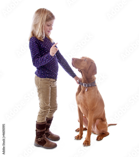 Photo: Little girl with her dog Little girl with her dog