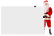 Full length Santa holding large blank sign