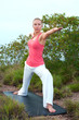 Beautiful blond female workout on the beach