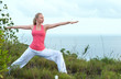 Beautiful blond female workout on the beach