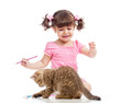 painting child girl with playful kitten