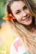 young girl with lily flower in hair