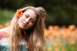 young girl with lily flower in hair