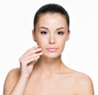 Beautiful woman touching face