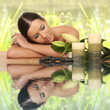 woman relaxing in spa, with reflection on the water