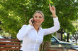 Blonde Business Woman Waving