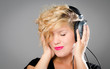 Foto: Pretty girl listening to headphones Pretty girl listening to headphones