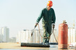 Flat roof covering repair works with roofing felt
