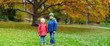 Two kids in an autumn park