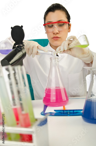 Photo: Female chemist in studio on white Female chemist in studio on white
