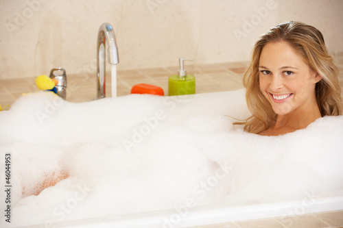 Photo: Woman Relaxing In Bubble Filled Bath Woman Relaxing In Bubble Filled Bath