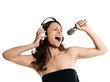 Photo: Portrait of a beautiful woman with microphone and headphones sin Portrait of a beautiful woman with microphone and headphones sin