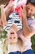 Photo: Father Holding Daughter Upside Down Outdoors Father Holding Daughter Upside Down Outdoors