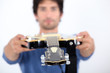 Man holding an electric guitar