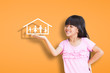 Photo: Smiling little girl showing on family symbol Smiling little girl showing on family symbol