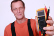 Electrician holding voltmeter