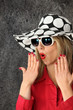 Shocked woman in a hat