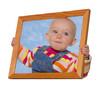 Baby holding a frame around her head