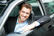 Photo: Young man sitting in a car Young man sitting in a car