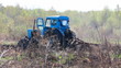 tractor plowing at spring