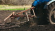 tractor plowing at spring