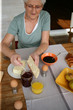Foto: Senior woman eating her breakfast Senior woman eating her breakfast