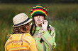Photo: Young rastafarian people in autumn park Young rastafarian people in autumn park