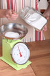 Man weighing sugar on scales