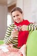 sick woman uses handkerchief