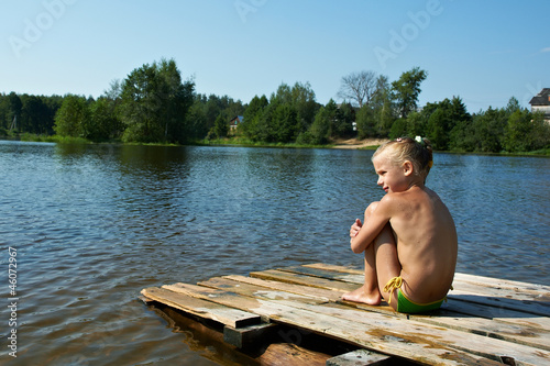 Photo: Little girl sits on a raft Little girl sits on a raft