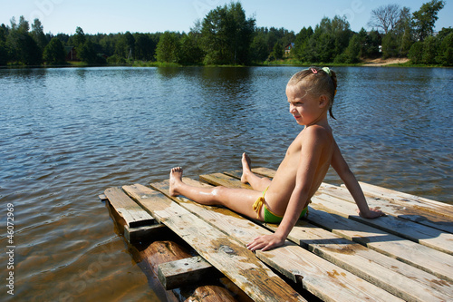 Photo: Little girl sits on a raft Little girl sits on a raft