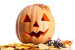 halloween pumpkin and autumn leaves, isolated on white