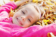 girl lying on yellow leaves
