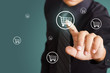 Business man pressing shopping cart icon