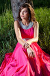 Foto: Woman in a long pink dress Woman in a long pink dress