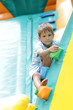 young happy boy having fun on trampoline outdoors
