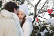 Photo: young loving couple on natural winter background young loving couple on natural winter background