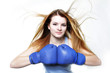 Photo: young woman in boxing gloves isolated over white young woman in boxing gloves isolated over white