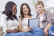 Young Women Using Tablet Computer At Home