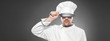 Chef  posing against gray background