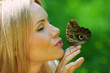 Woman playing with a butterfly