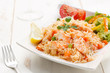dish of seafood rice with salad
